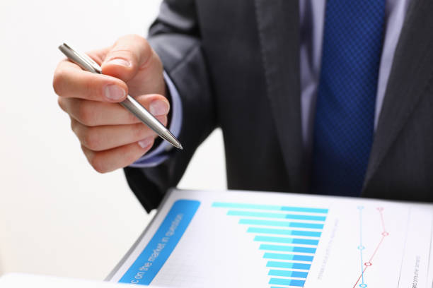 istock Male hand holding silver pen 849805804