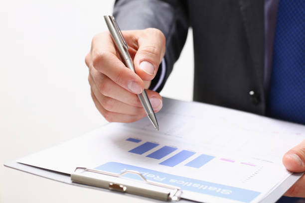istock Male hand holding silver pen 849806076