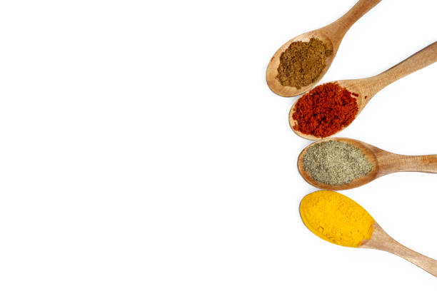 istock spices on wood spoon paprika cinnamon black pepper on white background 849806754
