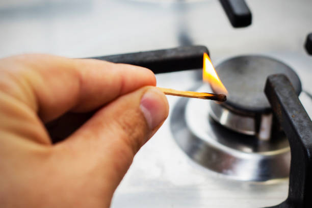 istock A man lighting the gas-stove with a match 849807022