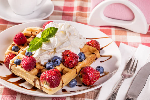 istock Belgian waffles with whipping cream 849817442
