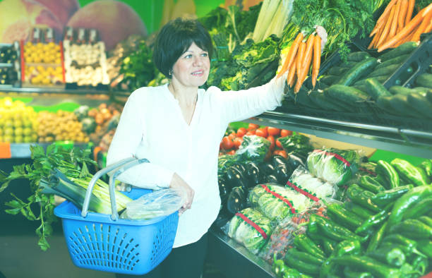 istock Mature woman buying fresh vegetables 849818680