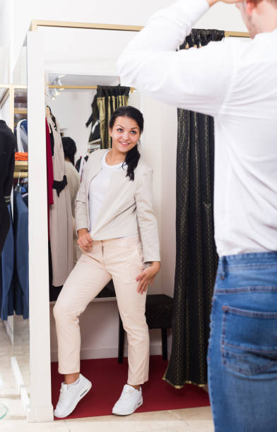 istock Glad adult couple purchasing jacket 849819510