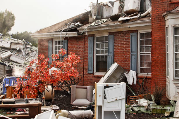 Red brick house, damaged by a natural disaster. stock photo