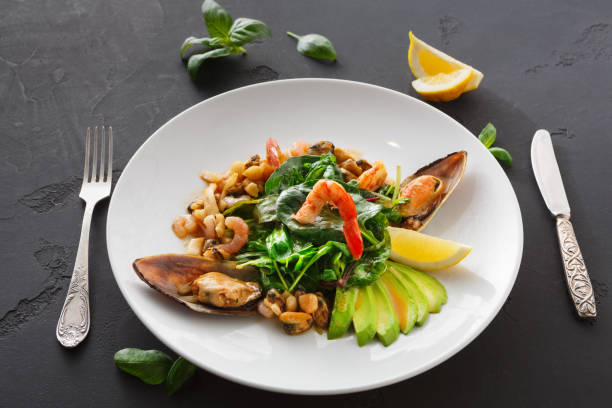 istock Warm salad with grilled seafood and cutlery 849828200