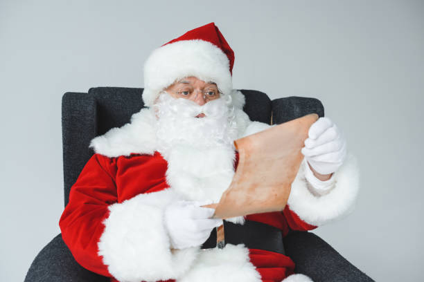 istock santa claus with wish list 849829482