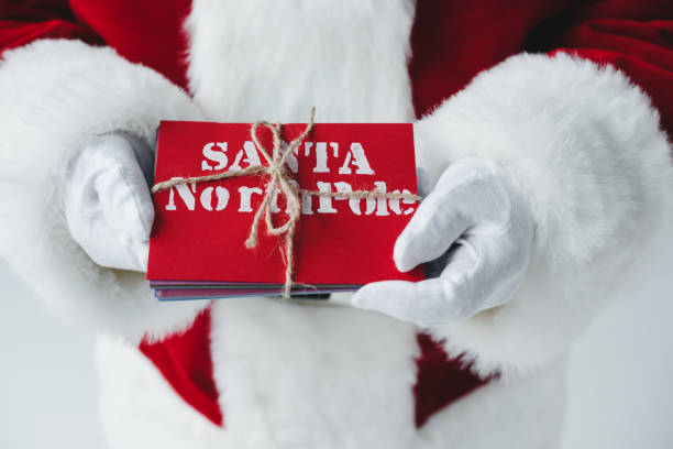 istock santa claus holding letters 849832788