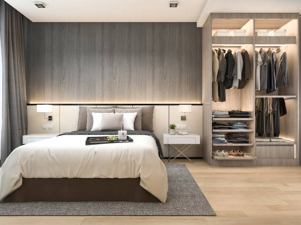 3d rendering luxury modern bedroom suite in hotel with wardrobe and walk in closet stock photo