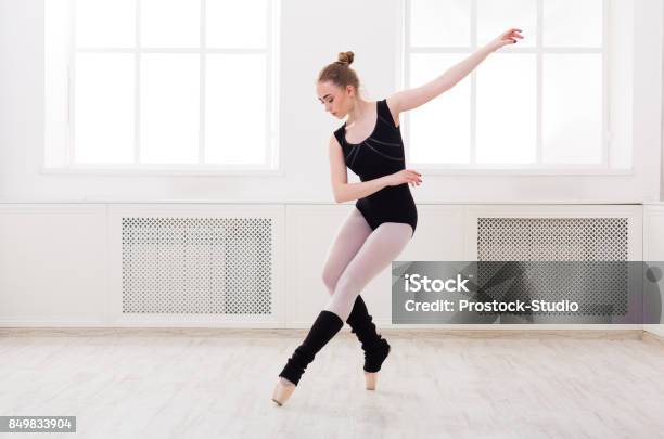 Beautiful Ballerina Stands In Ballet Assemble Stock Photo - Download Image Now - Dancing, Ballet, Dancer