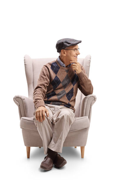 istock Elderly man sitting in an armchair and looking away 849836678