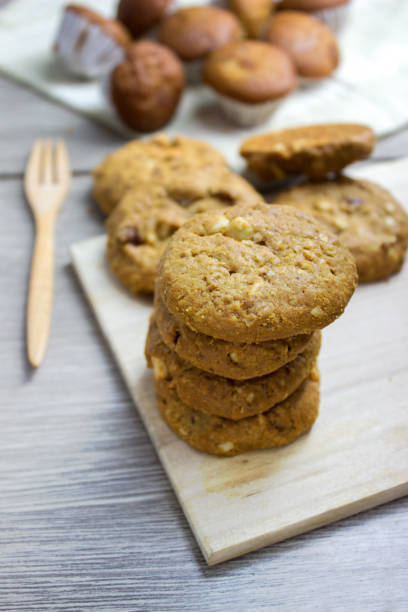 istock Cookies on wood cup cake blur background 849841290
