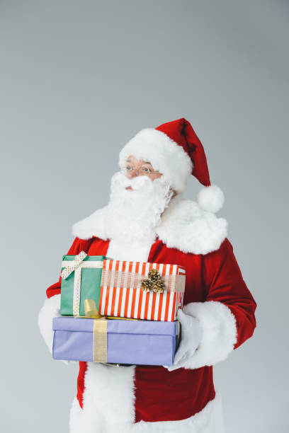 istock santa claus with gift boxes 849841388