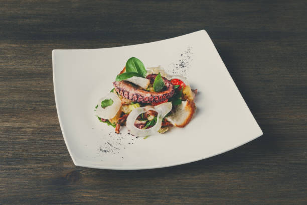 istock Salad with octopus and vegetables top view 849842312