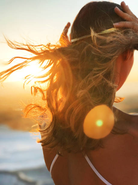 istock Beautiful woman at gold sunset light 849845406