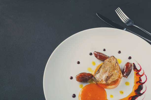 istock Roasted goose liver with date fruit and apple 849845610