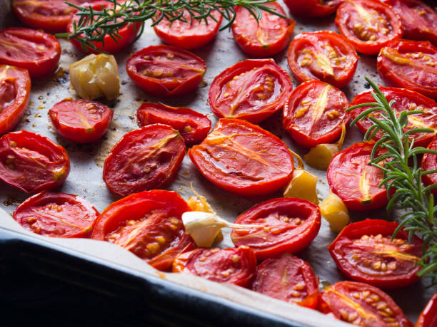istock Red heirloom tomatoes baked with garlic 849847340