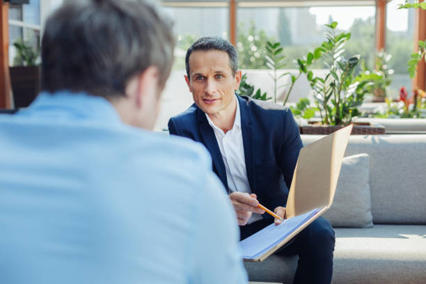 istock Pleasant handsome businessman looking at his business partner 849854330