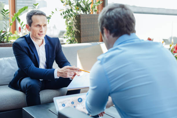 istock Successful handsome entrepreneurs talking to each other 849854382