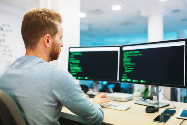 istock Portrait of young programmer working in office 849858410