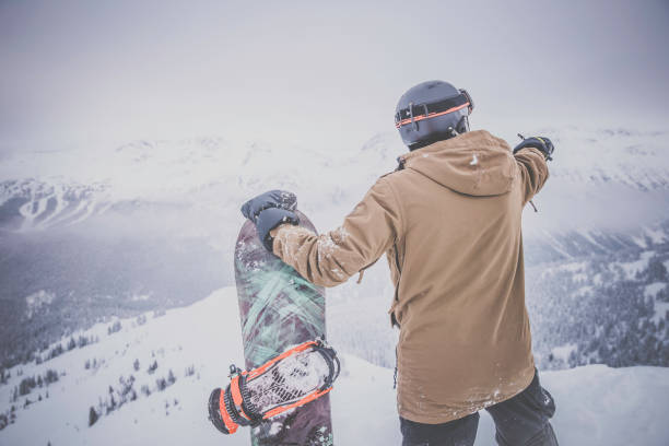istock Backcountry Snowboarder on Mountain Summit 849859694