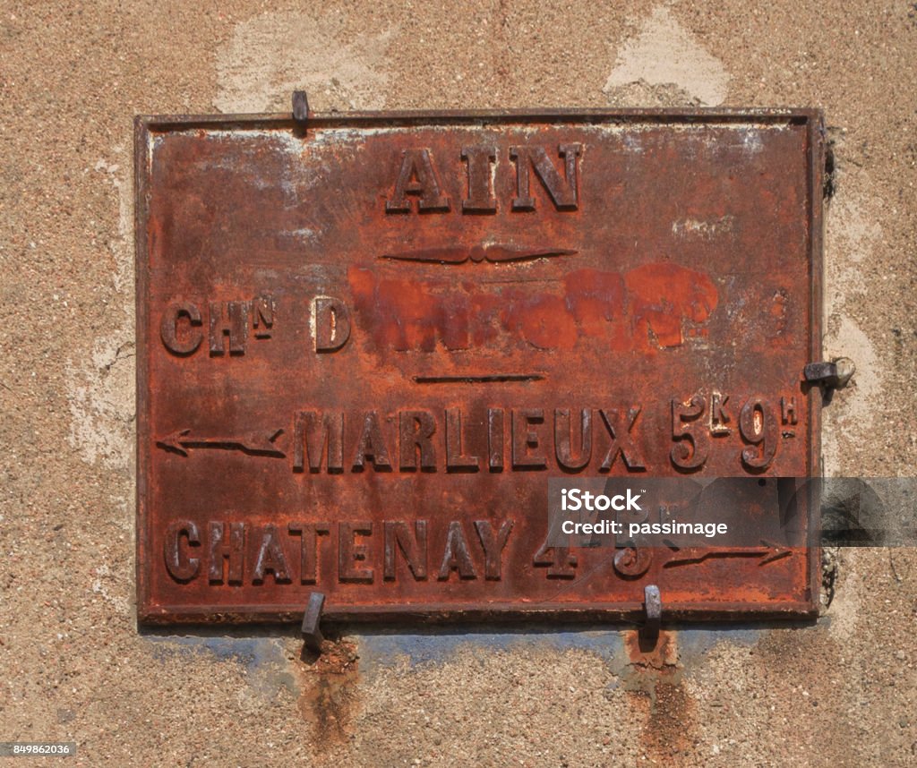 Indicator tables or placards. Cast iron or zinc checkerboards with letters and numbers in relief, they indicated the directions and distances that are expressed in Kilometers and hectometer in the XlXth century. Ain - France Stock Photo