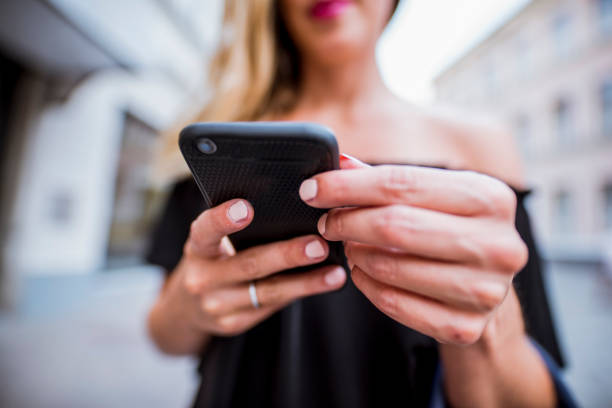 istock Woman using smartphone in the city 849863512