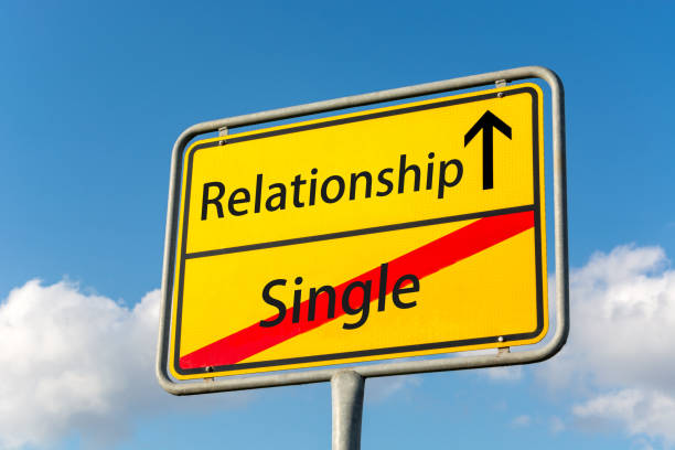 istock Yellow street sign with a relationship ahead leaving single status behind close up 849869932