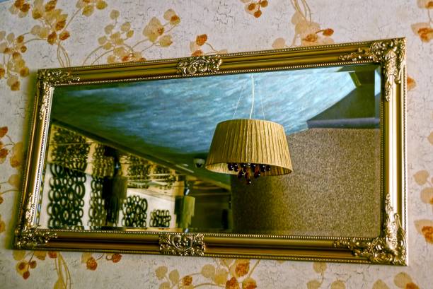 istock A large mirror on the wall and a chandelier on the ceiling in reflection 849870042