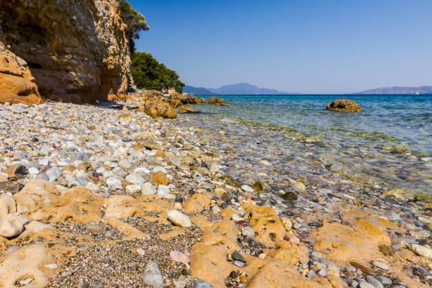 istock Sea erosion of rugged cliffs on rocky coastline 849873672
