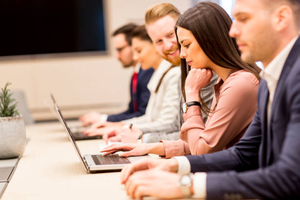 istock Young business people working together in office 849878308