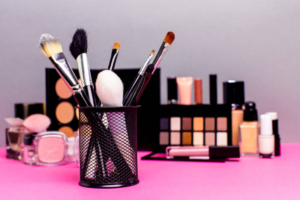 istock Set of colorful cosmetics on pink table 849878476