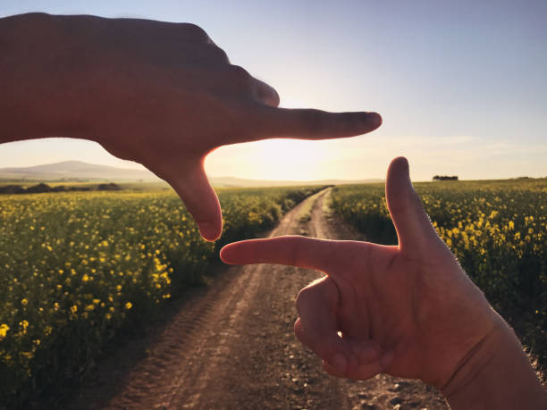 What a picture this would make! Cropped shot of an unrecognizable person finger framing the countryside hand cropping photos stock pictures, royalty-free photos & images