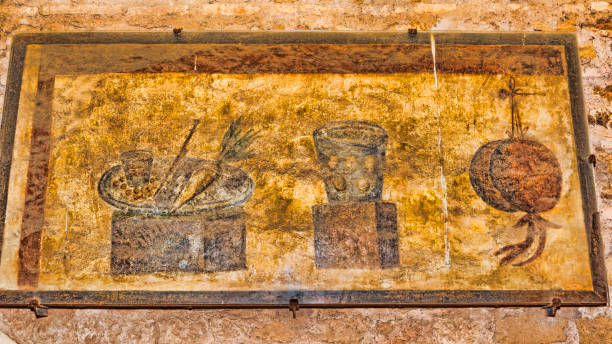 interior of the caseggiato del termopolio : decorative still life fresco - ostia antica - rome , italy - roman ancient rome empire ancient imagens e fotografias de stock
