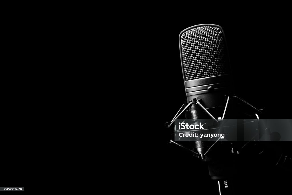 studio condenser microphone, isolated on black. copy space on left Microphone Stock Photo