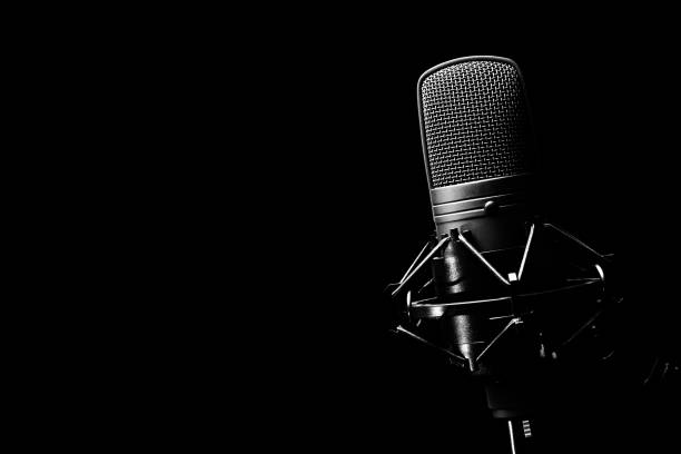 studio condenser microphone, isolated on black. copy space on left stock photo