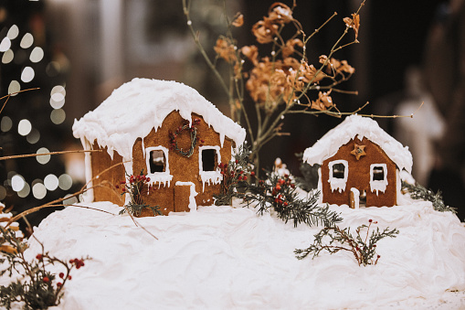 Noel Ginger bread houses on whipped cream for snow effect