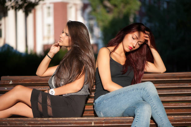 istock Girls sitting on a bench 849887688