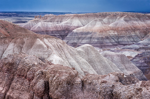 Sedimentary layers of blueish bentonite clay in the Blue Mesa Hills observed from a paved 1 mile hiking loop trail in the Painted Desert, Petrified Forest National Park, northeastern Arizona, USA