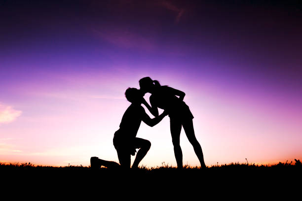 istock silhouette of romantic lovers with sunset on the back 849898058