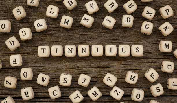 istock Word TINNITUS written on wood block 849902448