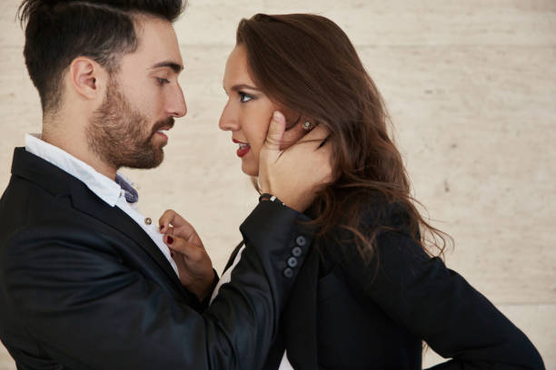 istock Young businessman touching his girlfriend face 849930026