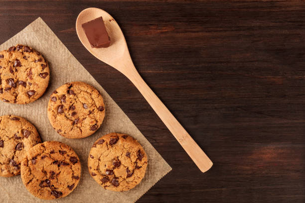 istock Chocolate chips cookies on baking paper with copy space 849931612