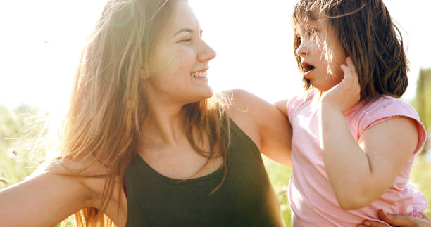 istock Little girl with special needs enjoy spending time with mother 849934244