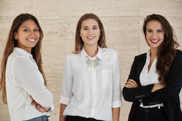 istock Young businesswomen standing together smiling 849934672