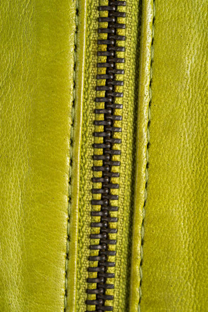 istock Green leather jacket zippers. Leather jacket macro details. Jacket zippers and pockets 849934834