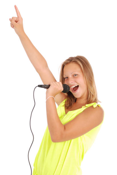 istock Happy young beautiful girl singing with microphone 849938392