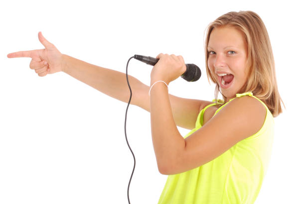 istock Happy young beautiful girl singing with microphone 849938486