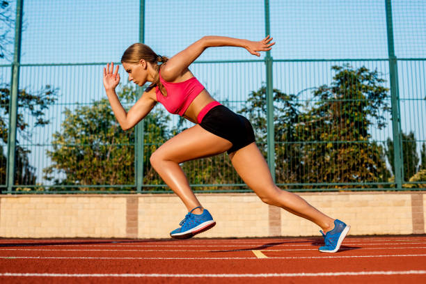 istock Runner sprinting towards success on run path running athletic track. Goal achievement concept 849946320