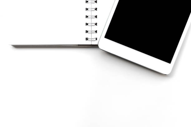 istock Tablet and white book,isolated white background top view 849949770