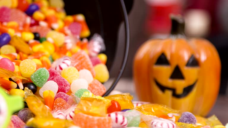 Little boy dresses up for Halloween with dad's help.